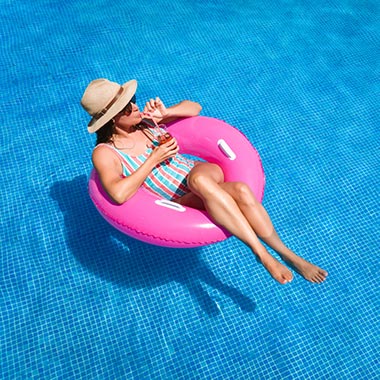 woman floating in pool